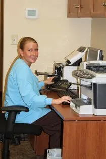 Dental staff member sitting at a desk
